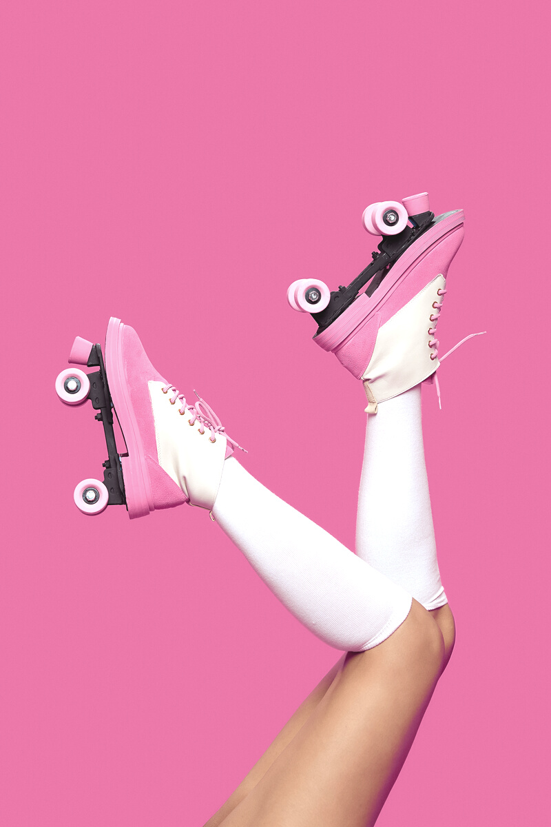 Person Wearing Pink Roller Skates