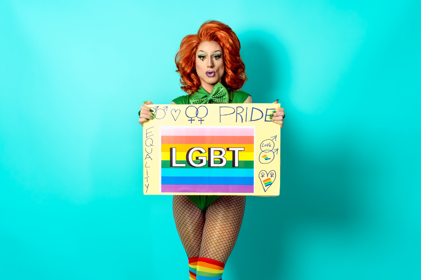 Drag Queen Holding a Pride Banner