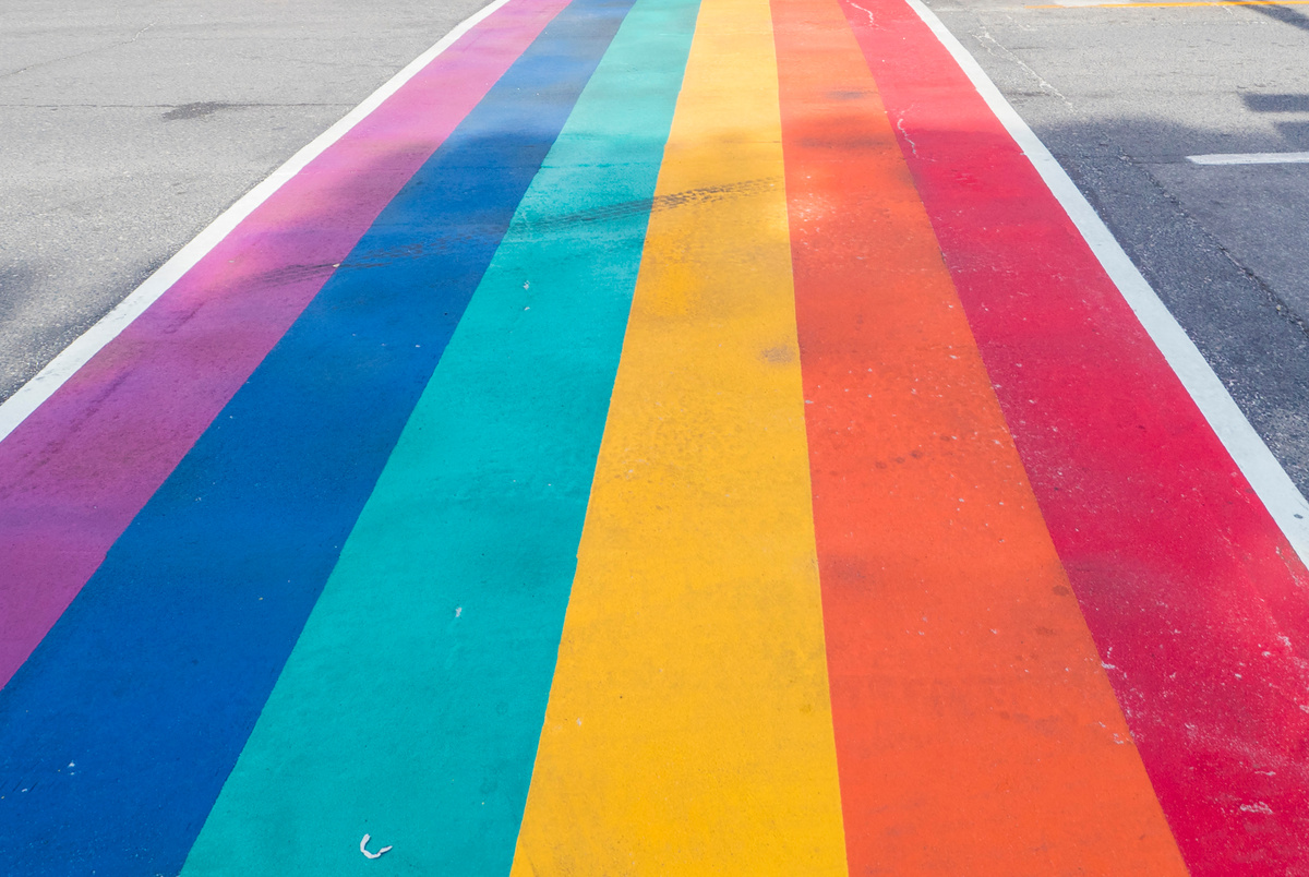 Rainbow coloured crosswalk for Pride Month on Church street in Toronto