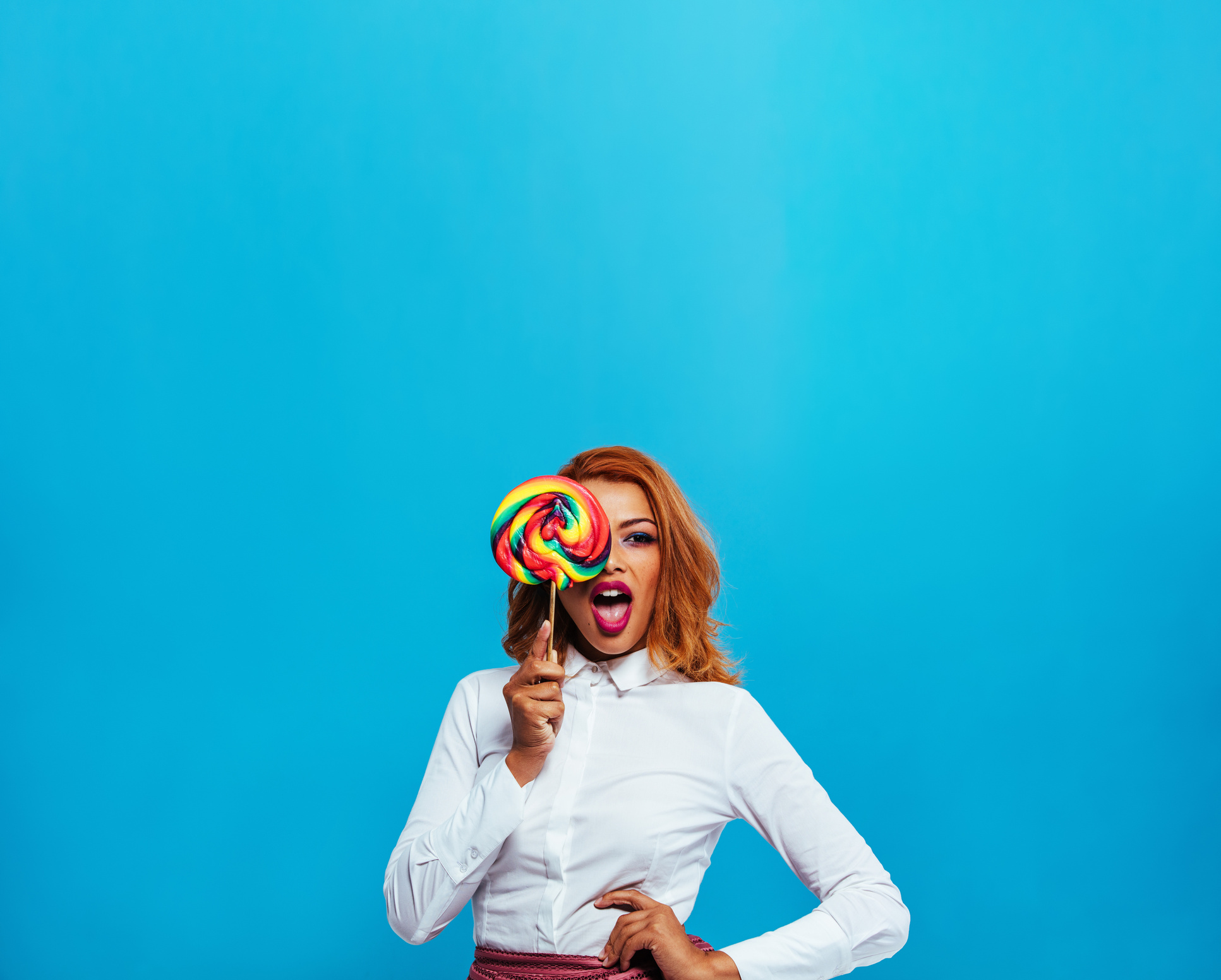 Beautiful Young Woman with Lollipop